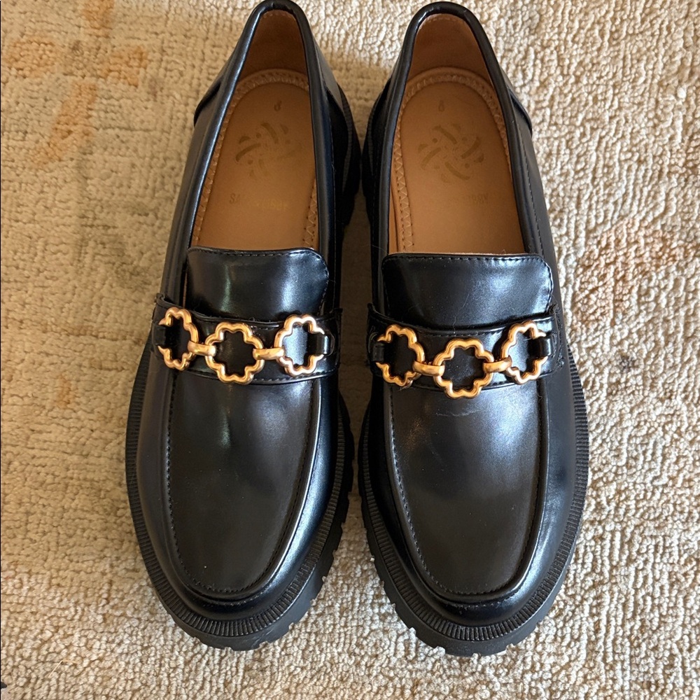 Black Leather Loafers with Gold Chain Accent